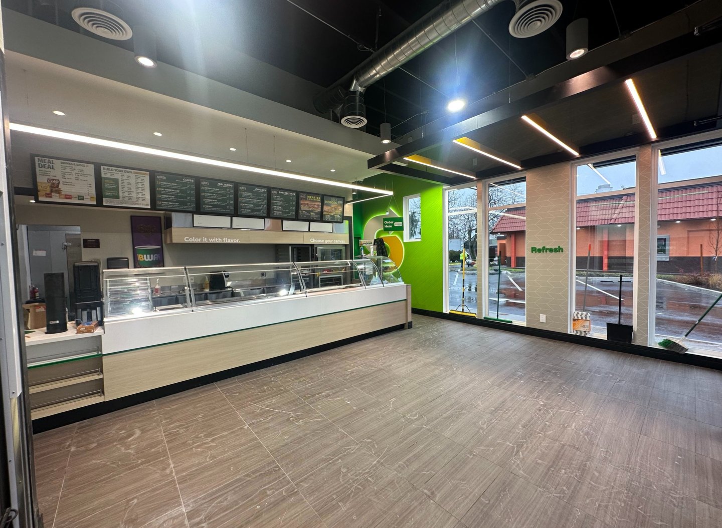 Completed restaurant buildout with custom lighting and finishes