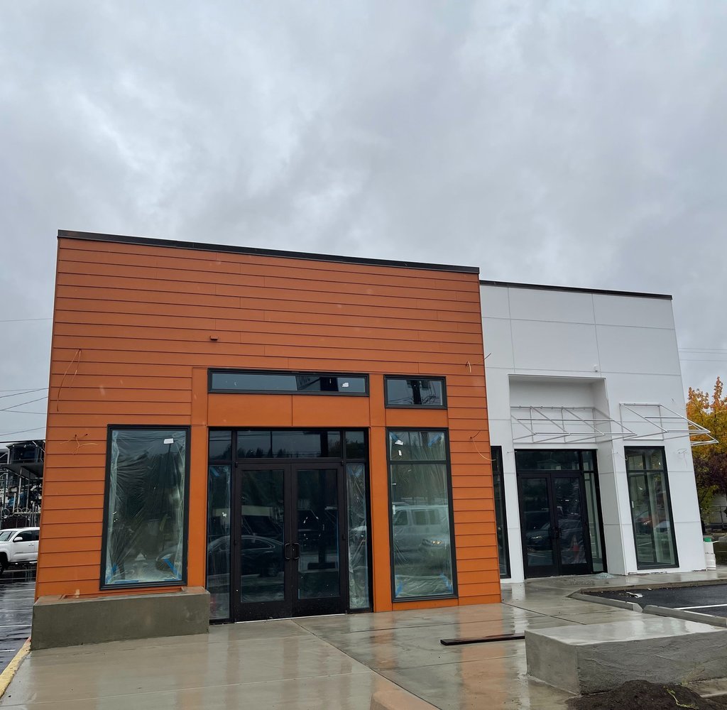 Modern commercial exterior with orange cladding